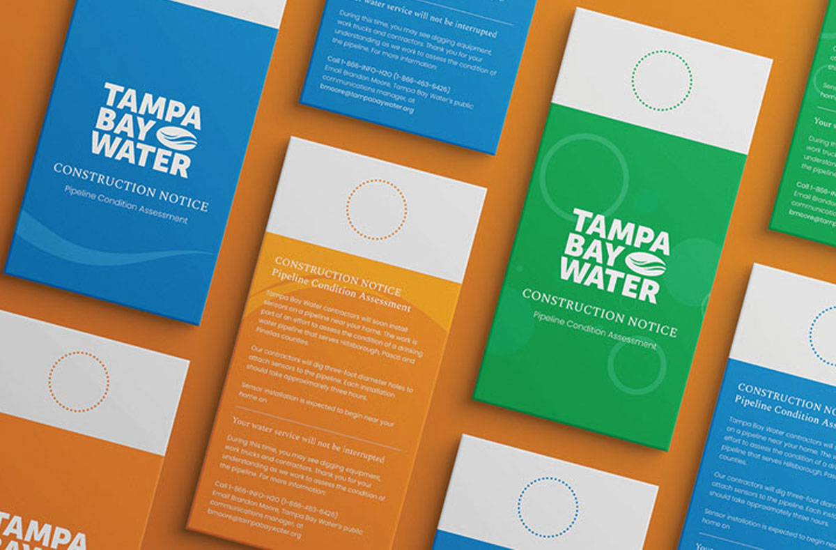 Construction notice door hangers in blue, orange, and green
